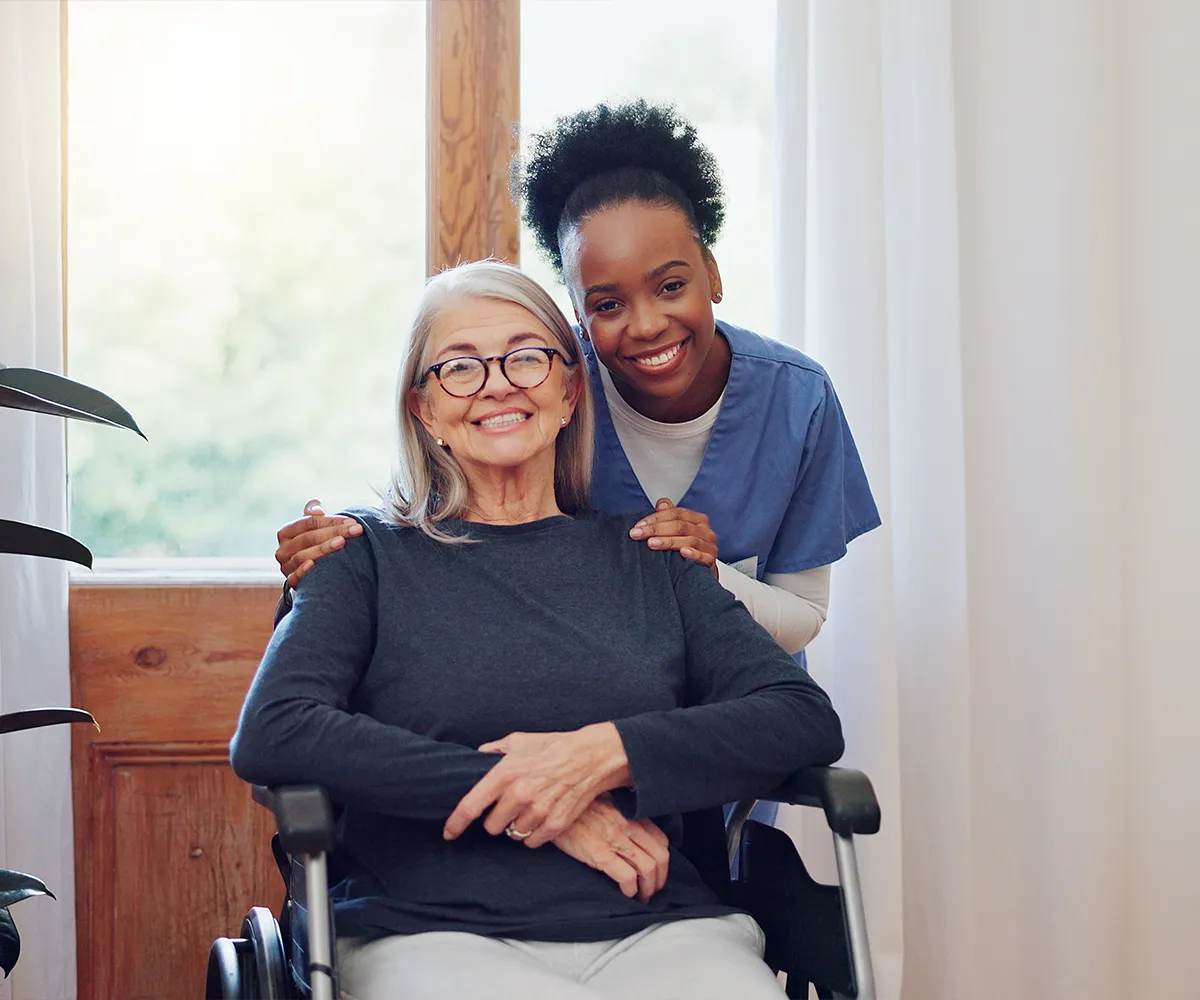 Compassionate caregiver providing adult day care services for elderly woman in a safe environment